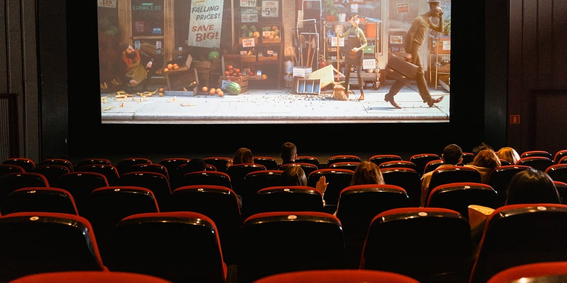 cartoon movie showing on theater screen